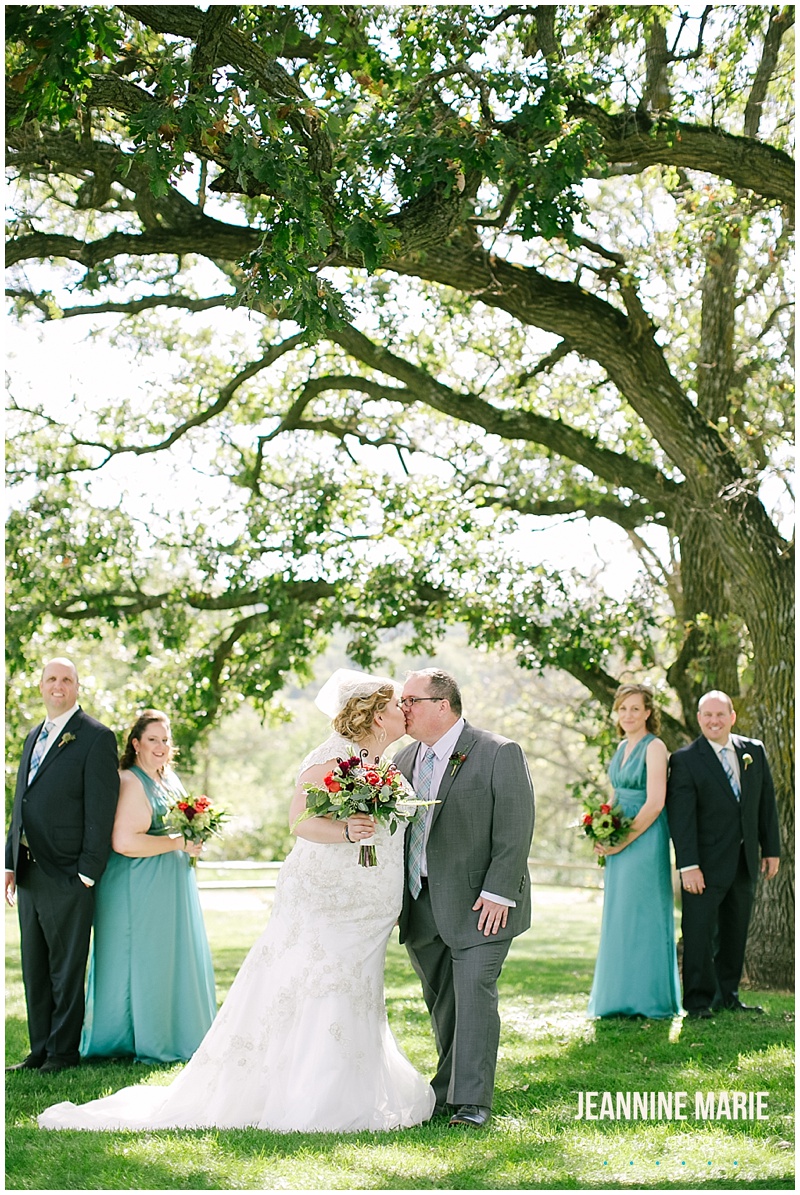 Cannon River Winery, bridal party, small bridal party, poses, wedding, bride, groom, kiss, tree, outside, blue bridesmaids dresses, floral, flowers