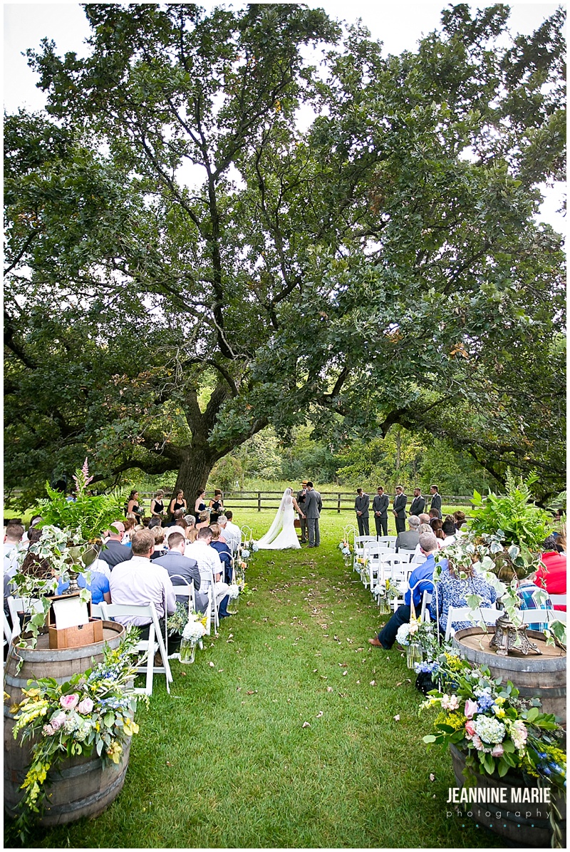 Mayowood Stone Barn, wedding ceremony, outside, outdoor, guests, decor, decorations, flowers, floral, tree, fence, bride, groom, wedding day