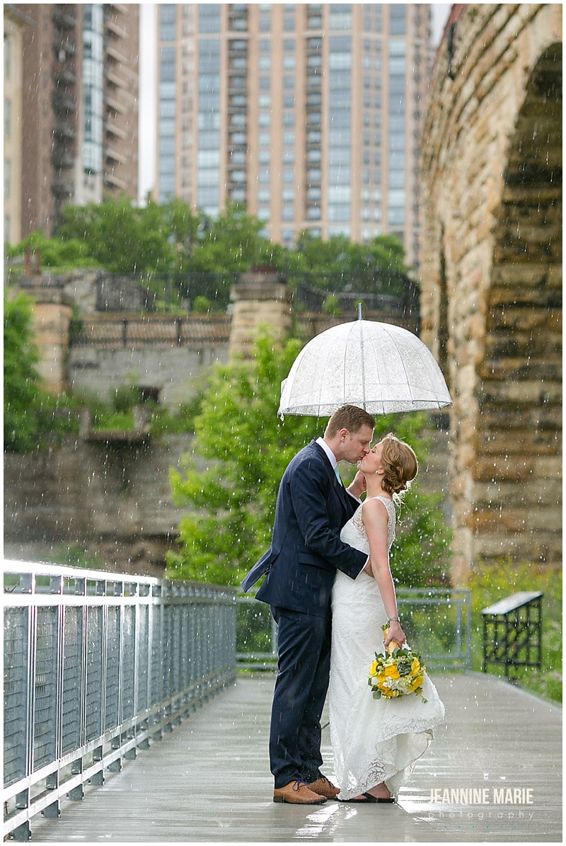 bride, groom, Minneapolis wedding photos, umbrella, rain, rainy wedding day, rain wedding portraits, wedding gown, groom attire