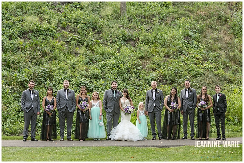 wedding portraits, bride, groom, groomsmen, bridesmaids, flower girls, lined up, teal flower girl dresses, black metallic bridesmaids dresses, gray suits, Leopold's Mississippi Gardens, Matt Wales Media, Best Day Ever!, Unreal Arrangements, Mintahoe Catering, Adagio Djay Entertainment, Carlson Craft, Lady Vamp Artistry, Lazaro, Schaffer's Bridal, Kate Spade shoes, The Wedding Shoppe, Men's Wearhouse, Country Inn and Suites, Jeannine Marie Photography, Minnesota wedding photographer, Saint Paul wedding photographer, Minneapolis wedding photographer, Leopold's Mississippi Gardens wedding photographer, summer wedding, real wedding, Minneapolis wedding, garden wedding, outdoor wedding, purple wedding, wedding inspiration