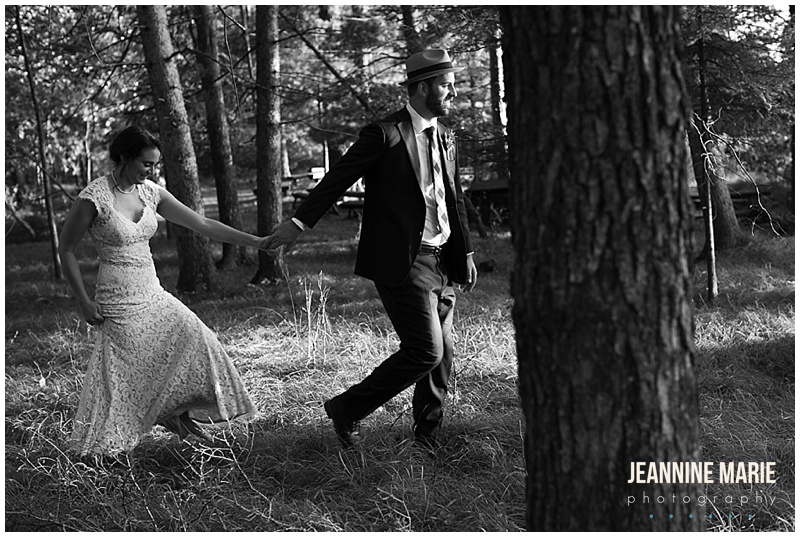 bride, groom, wedding gown, wedding dress, trees, black and white photo, leading through woods, Camp Thunderbird, Lumberjack wedding, camping wedding, woodsy wedding, wedding in the woods, Bemidji wedding, Bemidji wedding photographer, Minnesota wedding photographer, Jeannine Marie Photography, summer wedding, plaid wedding, outdoor wedding, Up North wedding, Northern Minnesota wedding, Jewish Wedding, KD Floral, Fozzies BBQ, The Lost Walleye Orchestra, The Party Store, Crystal Greene, Anthropologie, Minnesota wedding