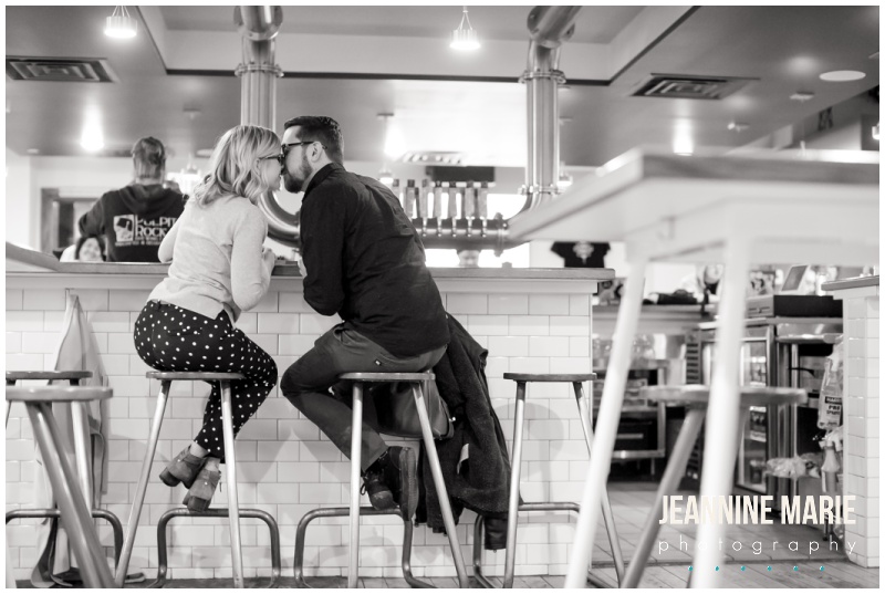 brewery, bar stools, bar, couple, kiss, 12welve Eyes Brewing, Union Depot, engaged, engagement session, engagement photos, Saint Paul, Saint Paul engagement, Saint Paul brewery, Saint Paul engagement photos, brewery engagement, brewery engagement photos, winter engagement photos, winter engagement, Jeannine Marie Photography, Saint Paul engagement photographer, Minnesota engagement photographer, engagement photography, Saint Paul engagement photography