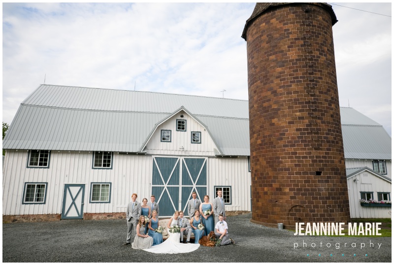 white barn, blue doors, wedding party, bride, groom, bridesmaids, groomsmen, blue bridesmaids dresses, Kennedy Blue bridesmaids, gray suits, Bloom Lake Barn, summer wedding, barn wedding, Minnesota barn wedding, blue wedding, rustic wedding, Minnesota wedding barns, Jeannine Marie Photography, Minnesota wedding photographer, Minneapolis wedding photographer, photographers near me, Saint Paul wedding photographer, wedding photography, barn wedding photographer, Bloom Lake Barn wedding photographer, Minneapolis wedding photography, Minnesota wedding photography, Studio B Floral, Unique Dining Catering, Bread Art, 139 Hair by Heidi, Laura Westrem Artistry, Che Bella Boutique, Kennedy Blue, Kohl's, Rustic Elegance, Ultimate Events, Minneapolis wedding vendors, Minnesota wedding vendors, Twin Cities wedding vendors