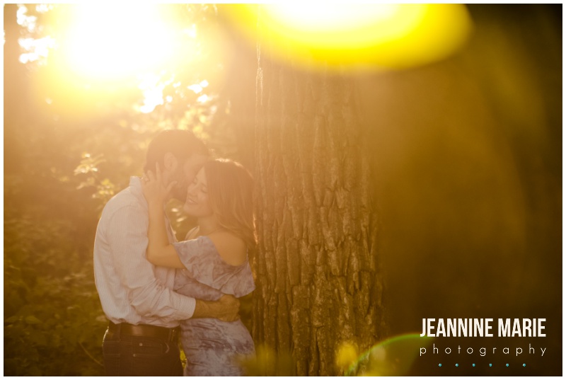 sun glow, kiss, trees, engaged, engagement, engagement session, engagement outfits, engagement photos, outdoor engagement session, Mississippi River, Mississippi River engagement, Minneapolis engagement photographer, Minnesota wedding photographer, Saint Paul engagement photographer, Jeannine Marie Photography
