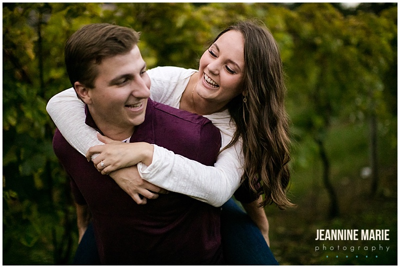 piggy back, couple, laughing, Aamodt's Apple Orchard, apple orchard engagement, apple orchard portrait session, fall engagement, fall portraits, fall engagement session, Twin Cities apple orchards, Minnesota apple orchards, Minnesota apple orchard engagement session, Minneapolis apple orchard engagement session, Jeannine Marie Photography, Minneapolis engagement session, Minnesota engagement session, Jeannine Marie Photography, Troy Burne Golf Club, Wisconsin wedding photographer, Minnesota wedding photographer