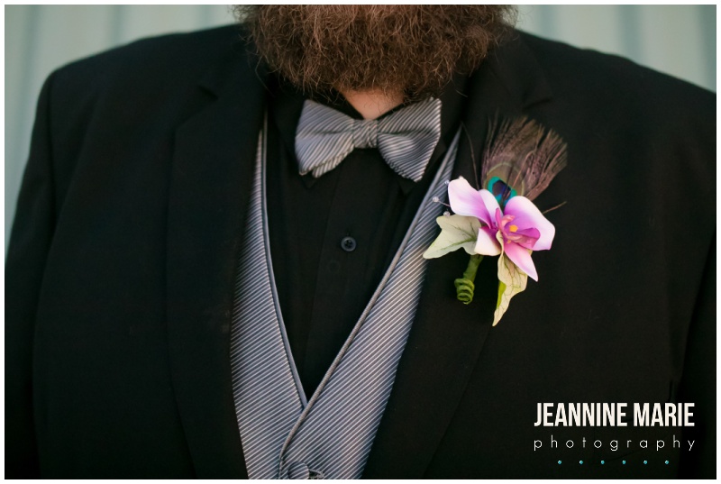 boutonniere, black suit, groom attire, Woodbury Central Park, indoor wedding venue, indoor amphitheater, winter wedding, evening wedding, jewel-toned floral, Dorothy Ann Bakery, Green Mill Catering, Wedding Connection, Black Suit, Steve Madden, intimate wedding, Jeannine Marie Photography, Saint Paul wedding photographer, Minnesota wedding photographer