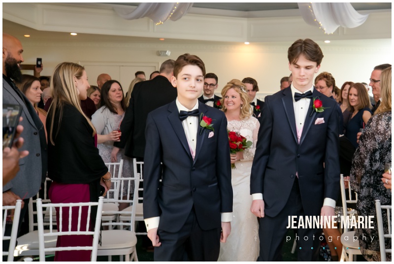 bride, sons, walk down aisle, St. Paul College Club, Valentine's Day wedding, red roses, red roses wedding, Johnson Jewelers, Dorothy Ann Bakery, Rocket man Entertainment, Jeannine Marie Photography, Minnesota wedding photographer, Saint Paul wedding photographer