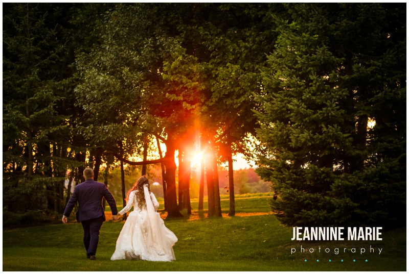 bride, groom, running, woods, hand in hand, sunset, sun glow, Mystical Rose gardens, fairytale wedding, outdoor wedding, outdoor Wisconsin wedding venue, Cinderella wedding, blue wedding, greenery, Cinderella carriage, lace ballgown, Jeannine Marie Photography, Wisconsin wedding photographer, covid wedding, pandemic wedding, romantic wedding, Dorothy Ann Bakery, Men's Wearhouse, Bella Bridal boutique, Creative Catering by Molly, Anna May Flowers, Men's Wearhouse, JJ's House, Zazzle, James Allen, Wisconsin Bride, wedding inspiration, wedding planning