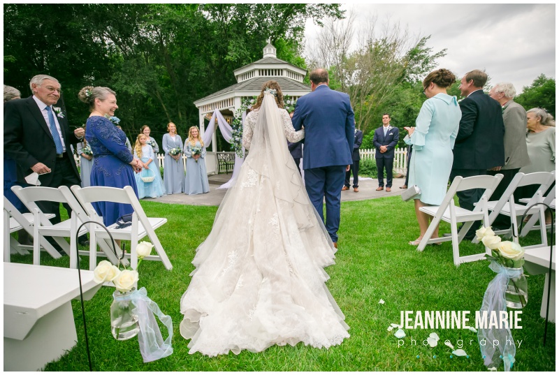 bride, father of bride, walk down aisle, outdoor ceremony, Mystical Rose gardens, fairytale wedding, outdoor wedding, outdoor Wisconsin wedding venue, Cinderella wedding, blue wedding, greenery, Cinderella carriage, lace ballgown, Jeannine Marie Photography, Wisconsin wedding photographer, covid wedding, pandemic wedding, romantic wedding, Dorothy Ann Bakery, Men's Wearhouse, Bella Bridal boutique, Creative Catering by Molly, Anna May Flowers, Men's Wearhouse, JJ's House, Zazzle, James Allen, Wisconsin Bride, wedding inspiration, wedding planning