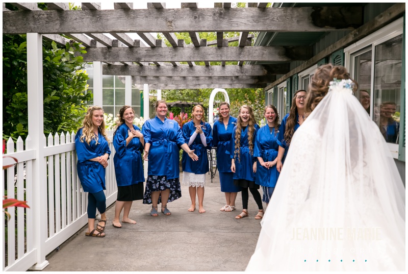 bride, first look, bridesmaids, blue bridesmaids robes, Mystical Rose gardens, fairytale wedding, outdoor wedding, outdoor Wisconsin wedding venue, Cinderella wedding, blue wedding, greenery, Cinderella carriage, lace ballgown, Jeannine Marie Photography, Wisconsin wedding photographer, covid wedding, pandemic wedding, romantic wedding, Dorothy Ann Bakery, Men's Wearhouse, Bella Bridal boutique, Creative Catering by Molly, Anna May Flowers, Men's Wearhouse, JJ's House, Zazzle, James Allen, Wisconsin Bride, wedding inspiration, wedding planning