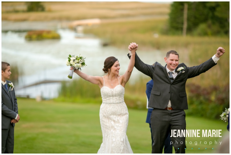 bride, groom, wedding ceremony, cheers, arms up, Northern Minnesota wedding, private residence, backyard wedding, pandemic wedding, intimate wedding, Northern Minnesota wedding photographer, Saint Paul wedding photographer, Jeannine Marie Photography