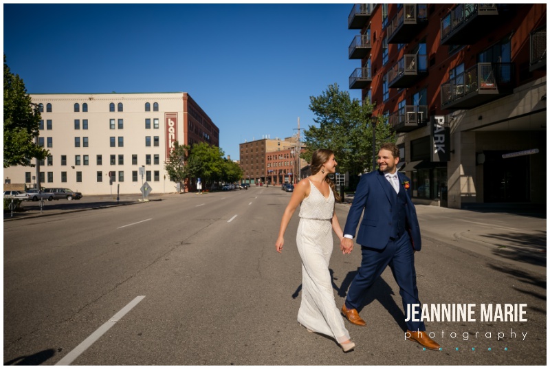 bride, groom, walk, hand in hand, street, Minneapolis, The Apt, urban wedding venue, intimate wedding venue, indoor wedding venue, Northeast Minneapolis wedding venue, Woodland Events, TDT Beauty, Ziel Bridal, Wilderland Floral, Whitey’s Old Town Saloon, Sugar and Spice Sweetery, Thirty Story, Minneapolis wedding photographer, Twin Cities wedding photographer, Minnesota wedding photographer, Jeannine Marie Photography