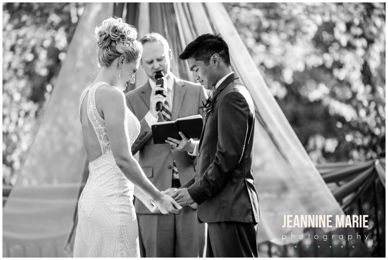 bride, groom, holding hands, black and white photo, outdoor ceremony site, wedding ceremony, Bunker Hills Event Center, cobalt blue, copper, fall wedding, outdoor wedding, Minnesota wedding, cobalt blue wedding, copper wedding, Jeannine Marie Photography, Minnesota wedding photographer, Minneapolis wedding photographer