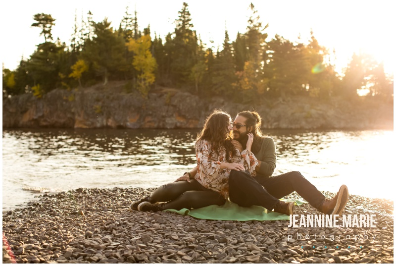 couple, blanket, beach, rocks, facing each other, Gooseberry Falls State Park, Split Rock Lighthouse, North Shore engagement session, Lake Superior engagement session, Jeannine Marie Photography, Minnesota engagement photographer, Northern Minnesota engagement photographer, Duluth engagement photographer, Duluth wedding photographer, Minnesota wedding photographer, fall engagement session, outdoor engagement session, lakeside engagement session