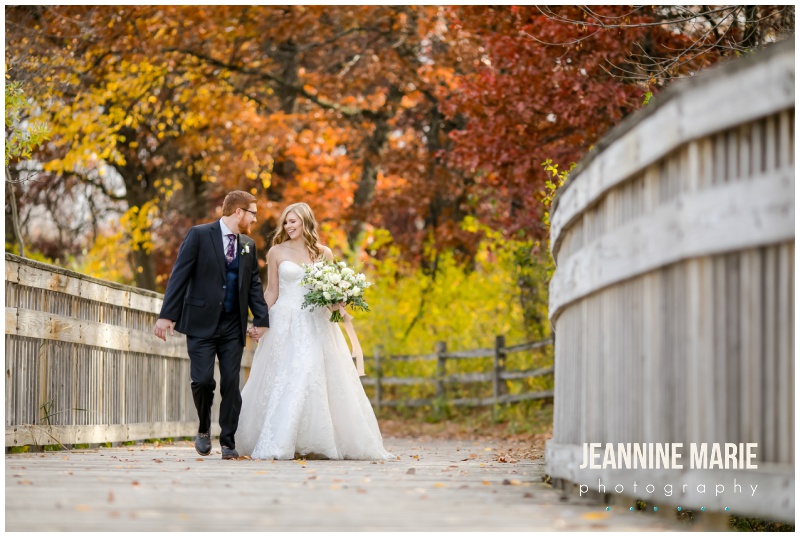 bride, groom, walking, bridge, hand in hand, Revive Church, fall wedding, Minnesota fall wedding, church wedding, Minnesota church wedding, Twin Cities church wedding, indoor wedding, fall colors, fall leaves, Minnesota fall, Jeannine Marie Photography, Minnesota wedding photographer, Twin Cities wedding photographer, Nothing Bundt Cakes, A Milestone Paper Co, David's Bridal, Abloom Events, Shane Co, LHN Beauty, Broadway Party & Tent Rental