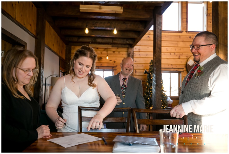 bride, groom, marriage license signing, social distancing, covid wedding, pandemic wedding, wedding planning, The River Lodge, winter wedding, Christmas wedding, cabin wedding, cozy wedding, casual wedding, Minnesota wedding, Minnesota cabin wedding, Jeannine Marie Photography, Minnesota wedding photographer, Saint Paul wedding photographer, Minnesota engagement
