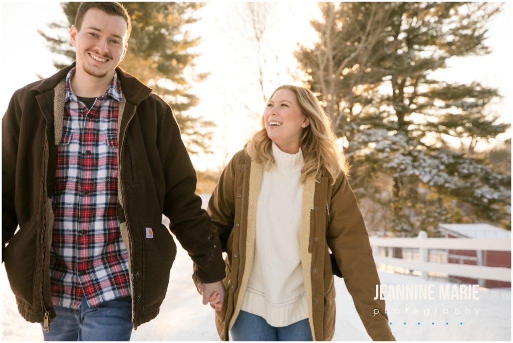 hand in hand, walking, white fence, snow trail, winter engagement session, snowy engagement session, rustic engagement session, outdoor engagement session, Hope Glen Farm, Jeannine Marie Photography, Saint Paul engagement photographer, Minnesota engagement photographer