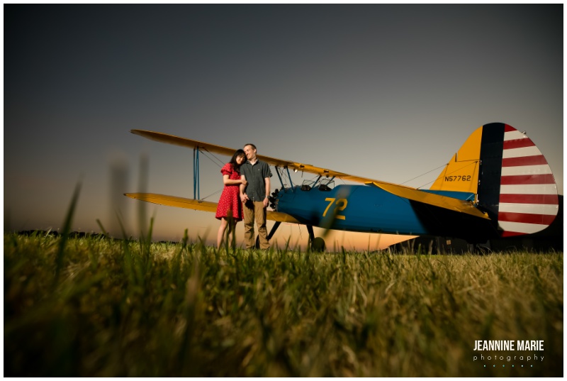 travel-themed engagement session, traveling couples, couple, airplane, two-seater private plane, blue plane, red dress, engagement portraits, engagement outfits, engagement photos, engagement session, Saint Paul engagement session, Twin Cities engagement session, airport engagement session, airplane engagement session, airport engagement portraits, airplane engagement portraits, St. Paul Downtown Airport, Saint Paul airport engagement, Saint Paul engagement photographer, Twin Cities engagement photographer, Saint Paul wedding photographer, Jeannine Marie Photography