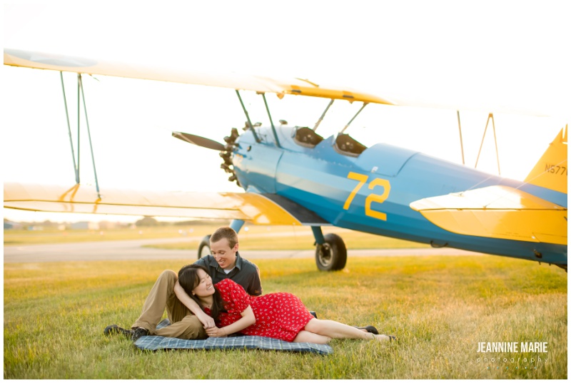 travel-themed engagement session, traveling couples, couple, airplane, two-seater private plane, blue plane, red dress, engagement portraits, engagement outfits, engagement photos, engagement session, Saint Paul engagement session, Twin Cities engagement session, airport engagement session, airplane engagement session, airport engagement portraits, airplane engagement portraits, St. Paul Downtown Airport, Saint Paul airport engagement, Saint Paul engagement photographer, Twin Cities engagement photographer, Saint Paul wedding photographer, Jeannine Marie Photography