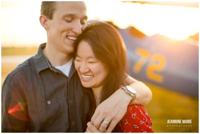 travel-themed engagement session, traveling couples, couple, airplane, two-seater private plane, blue plane, red dress, engagement portraits, engagement outfits, engagement photos, engagement session, Saint Paul engagement session, Twin Cities engagement session, airport engagement session, airplane engagement session, airport engagement portraits, airplane engagement portraits, St. Paul Downtown Airport, Saint Paul airport engagement, Saint Paul engagement photographer, Twin Cities engagement photographer, Saint Paul wedding photographer, Jeannine Marie Photography