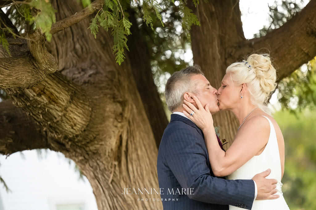 Portrait of bride and groom at minnesota country wedding photographed by photographer Jeannine Marie Photography
