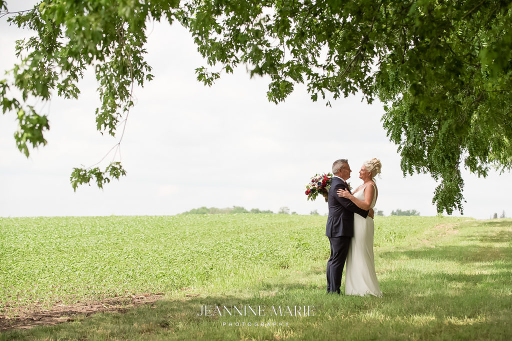 Portrait of bride and groom at country wedding photographed by Saint Paul photographer Jeannine Marie Photography