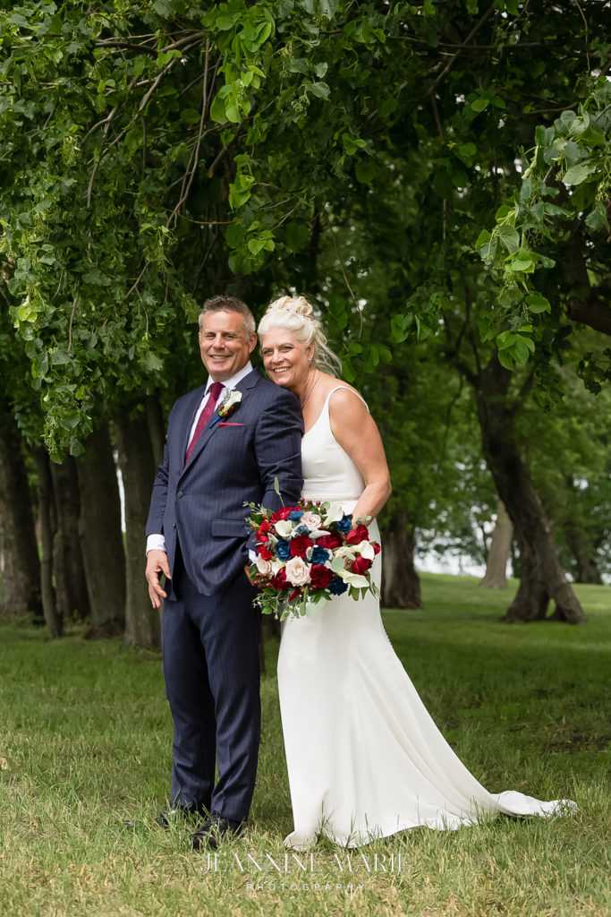 Portrait of bride and groom at rustic elegance wedding photographed by Minneapolis photographer Jeannine Marie Photography