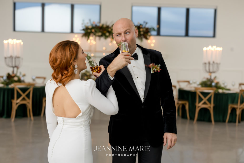 Bride and groom drinking at wedding photographed by Saint Paul photographer Jeannine Marie Photography