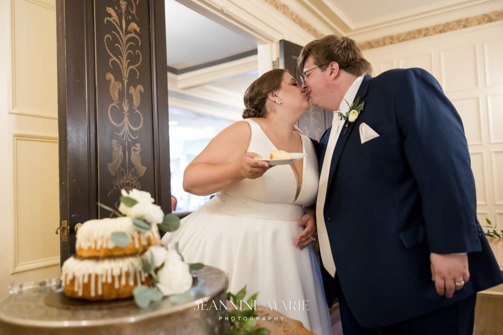 Wedding cake cutting portrait photographed by Saint Paul Wedding photographer Jeannine Marie Photography