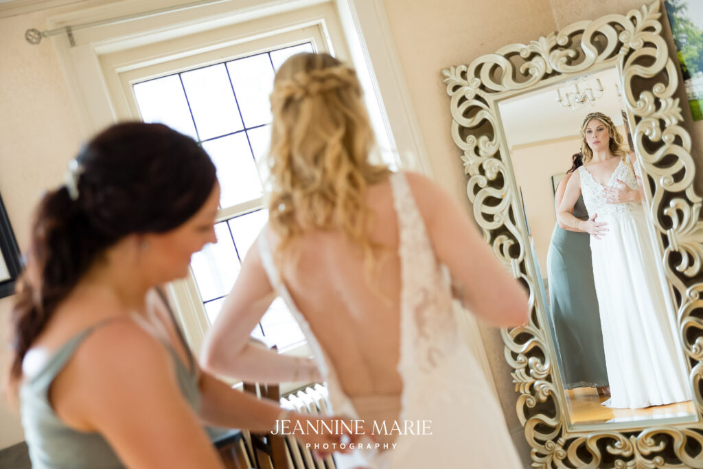 bride getting in wedding dress at the saint paul college club